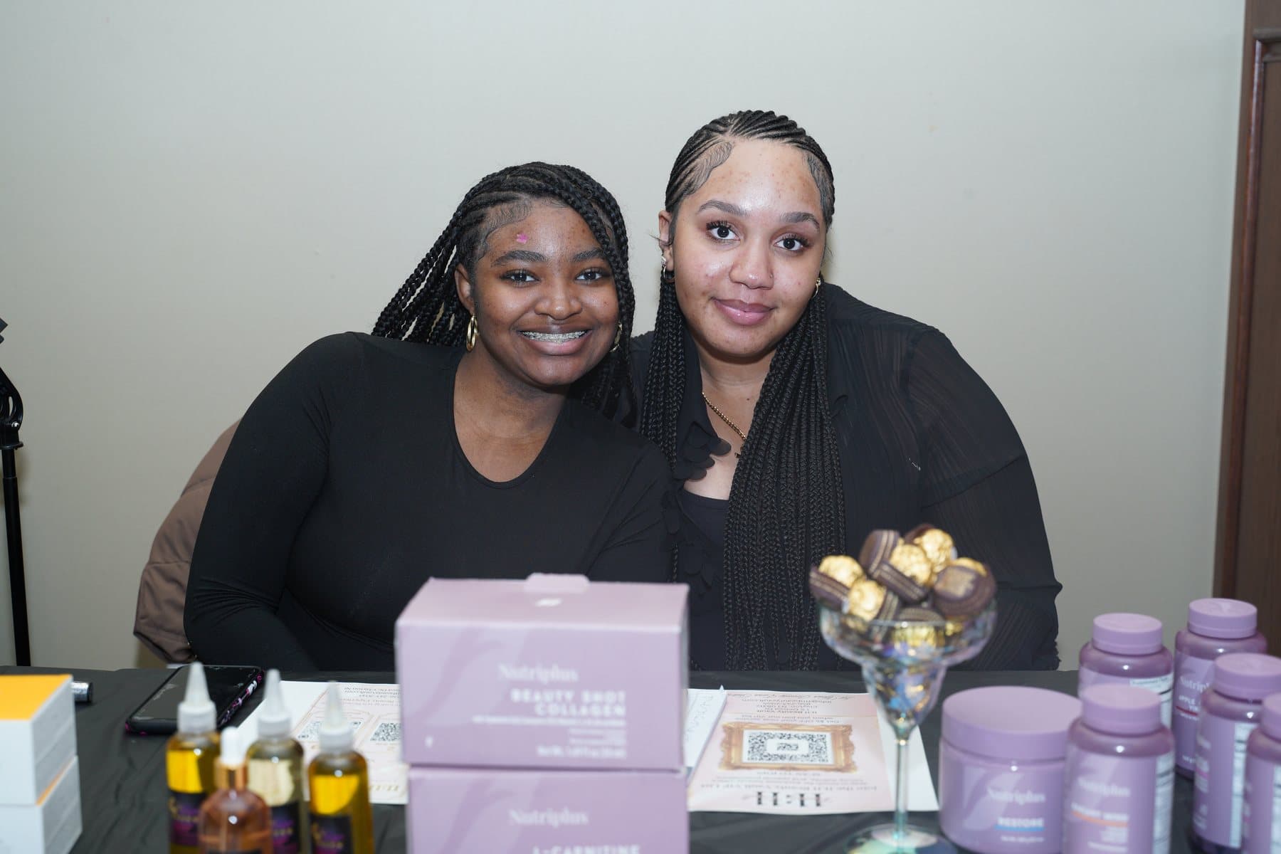 Women at a vendor table during the marketplace